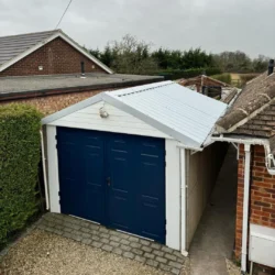 Newly installed sloped steel garage roof