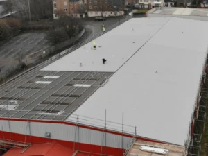 Aerial photo of an in-progress warehouse roof replacement in Birmingham