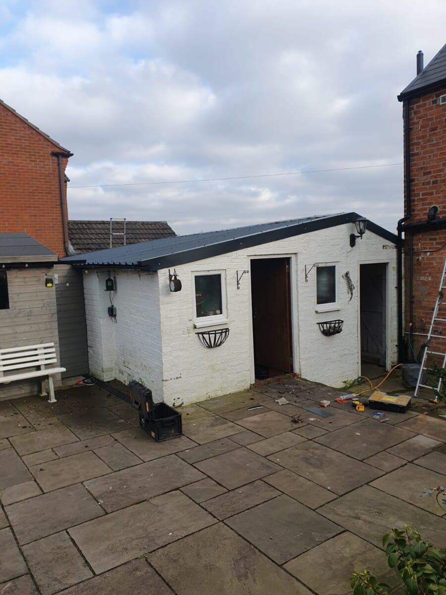 Large asbestos garage roof, after replacement in Derby, January 2025