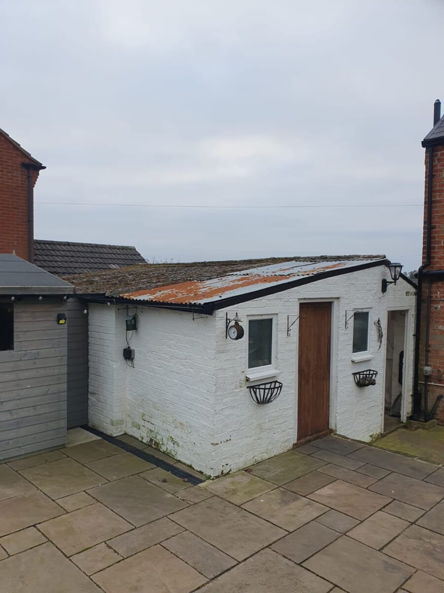 Large asbestos garage roof, before replacement in Derby, January 2025
