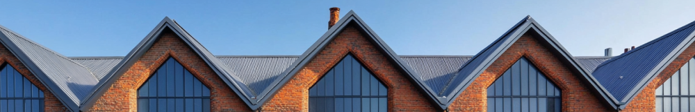 Complex pitched roof on a brick industrial building