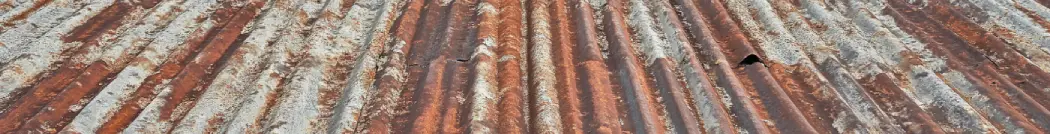 Old rusted garage roof which has not been well maintained